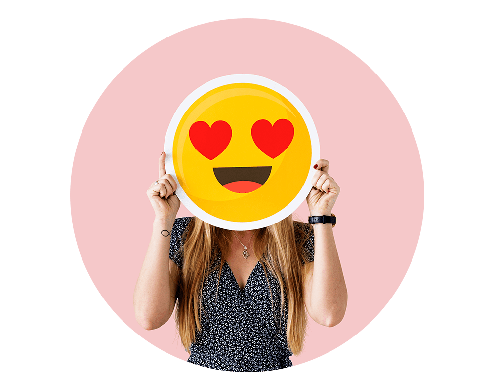 cheerful-woman-holding-emoticon-icon